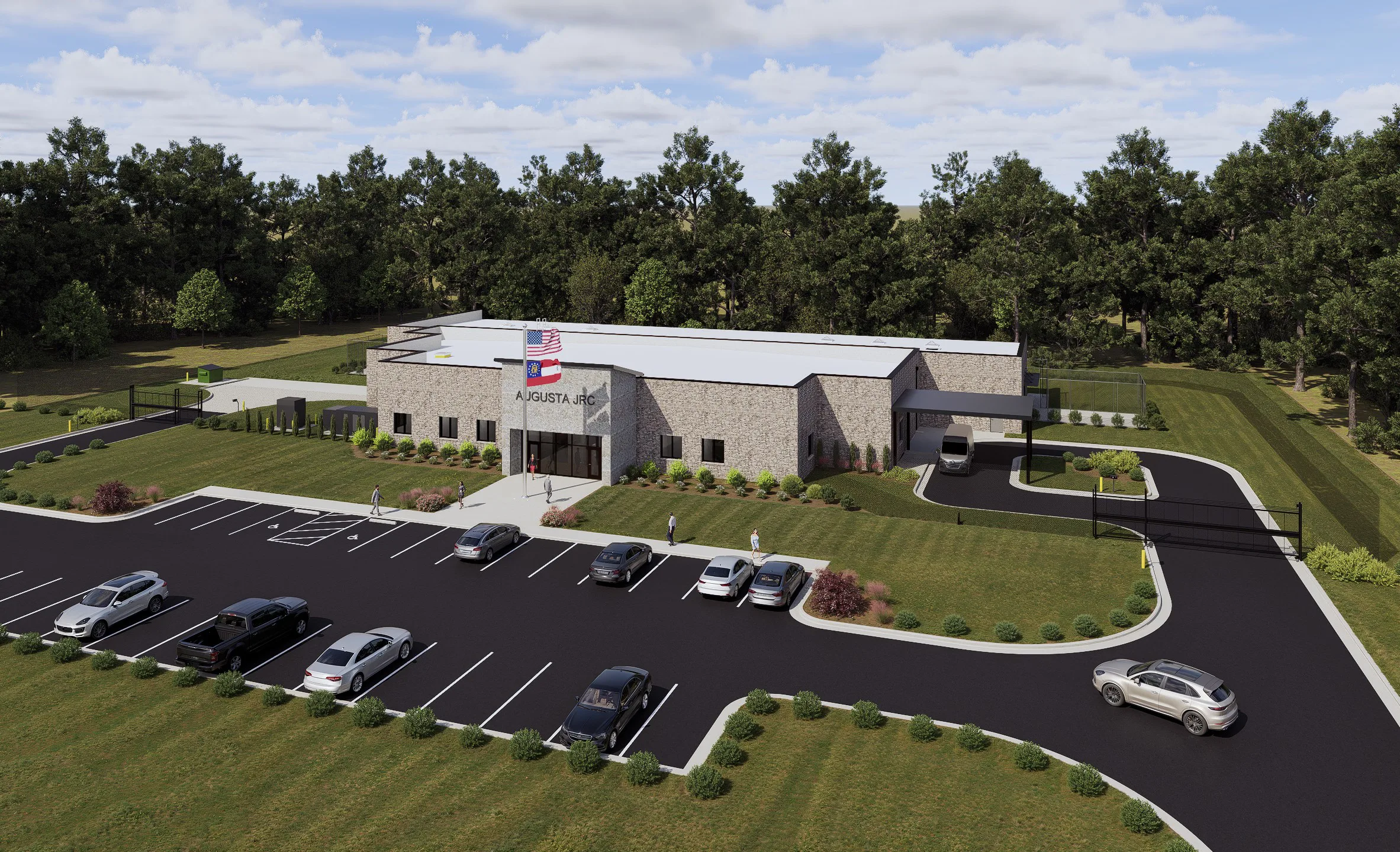 Architectural rendering of a single-story brick building with the sign Augusta JRC above the entrance, American and Georgia flags, a gated drive and a parking lot, surrounded by pine trees.