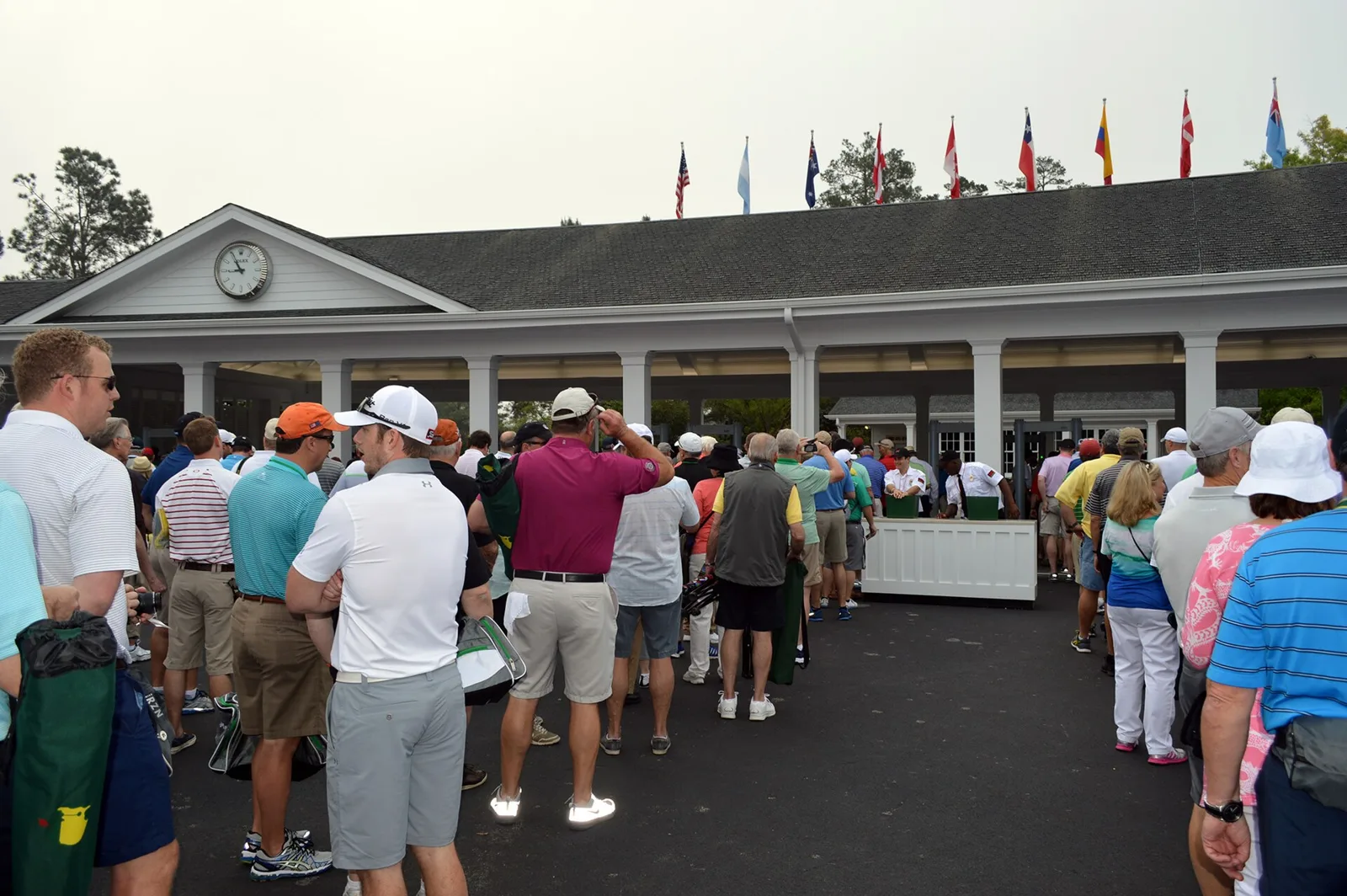 Masters patrons line up at the gates of Augusta National Golf Club during tournament week.