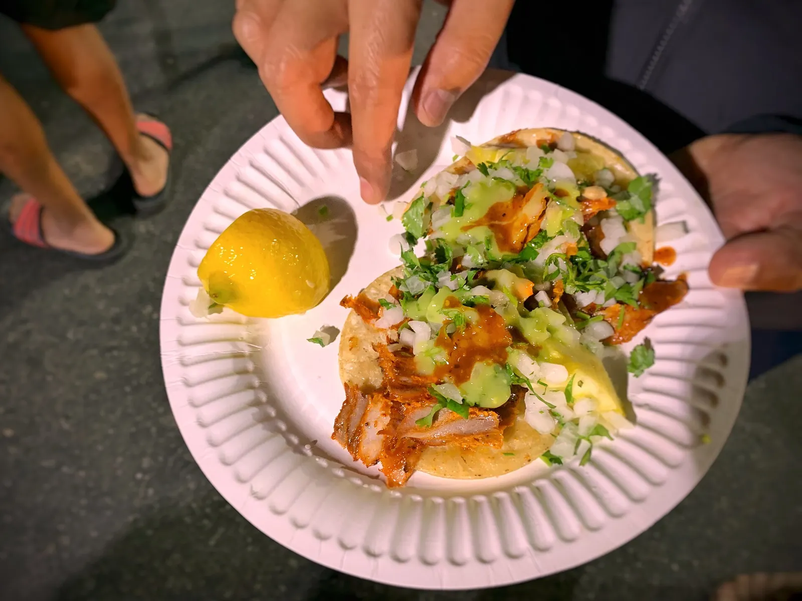 Tacos al pastor on a paper plate. The photo was taken in Los Angeles, not at an Augusta restaurant.