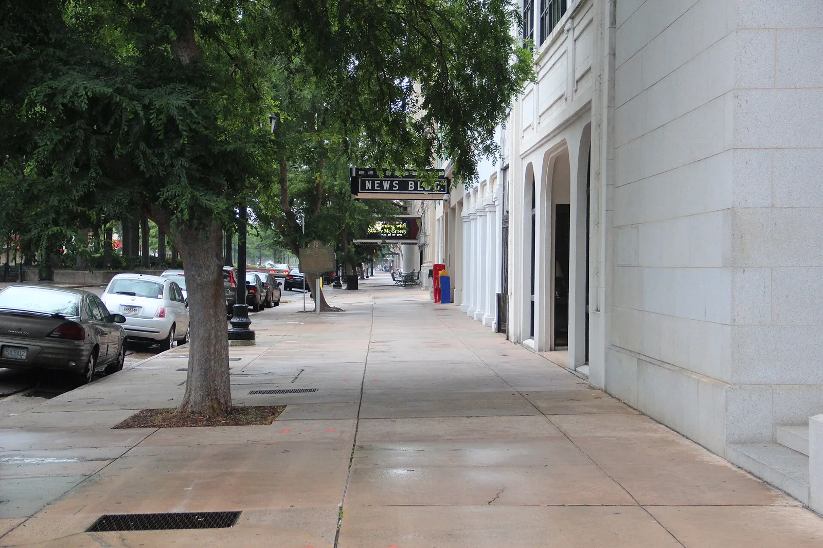 The sidewalk along Broad Street in downtown Augusta, lined with restaurants and shops.
