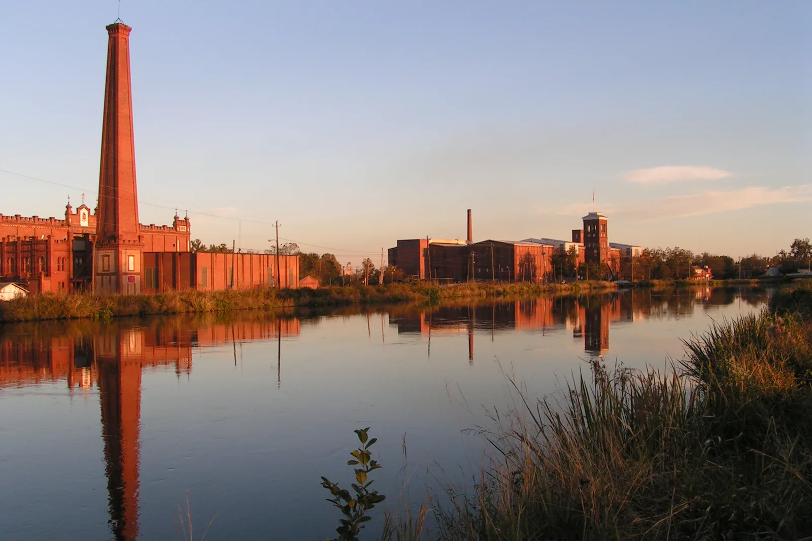The Sibley and King mills reflected in the Augusta Canal, near the start of the RunGiving 5K at the Mill Village Trailhead.