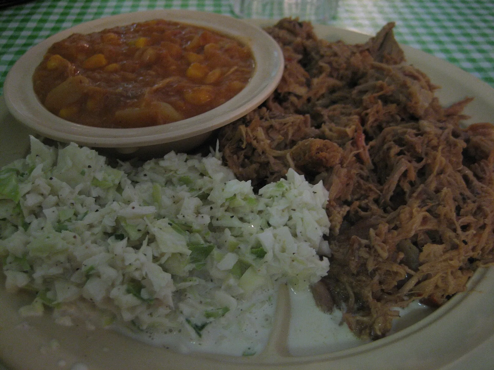 Pulled pork barbecue with coleslaw and Brunswick stew at a North Carolina barbecue restaurant, not in Augusta.