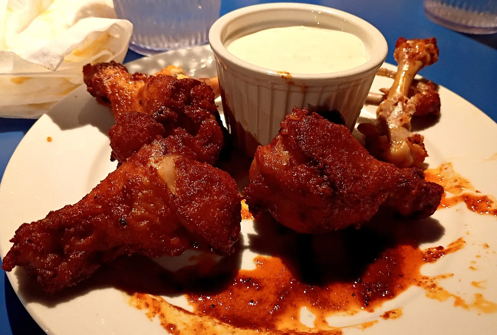 A plate of chicken wings with a cup of dressing. The photo was not taken at an Augusta restaurant.